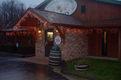 Conneaut Cellars Winery shown in the evening during extended holiday hours in December.