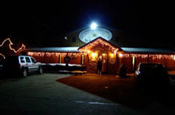 Conneaut Cellar Winery building in Conneaut Lake PA is shown with Christmas lights and decorations during the holidays.