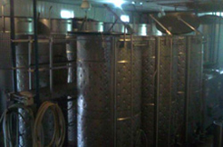 Conneaut Cellars Winery aging room with barrels of wine aging before being ready for bottling.