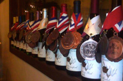 A row of winning wines is shown with their awards from 2015 and 2016.