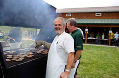 Employees grilling hamburgers at the Conneaut Cellars Winery Annual Harvest Picnic in September.