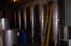 Wine being aged in barrels at Conneaut Cellars Winery production building.